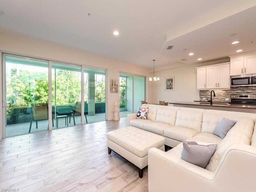 Nestled in a quiet alcove within the Avalon community, this - photo 2