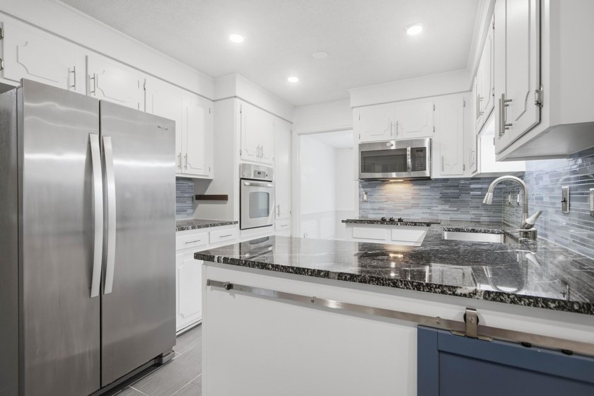 Situated on a spacious corner lot surrounded by mature trees - photo 29
