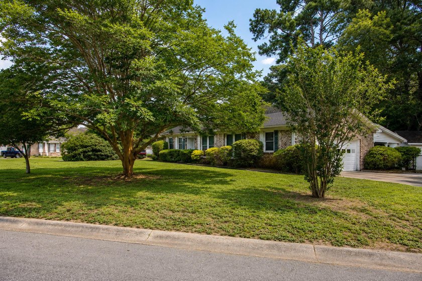 Situated on a spacious corner lot surrounded by mature trees - photo 36