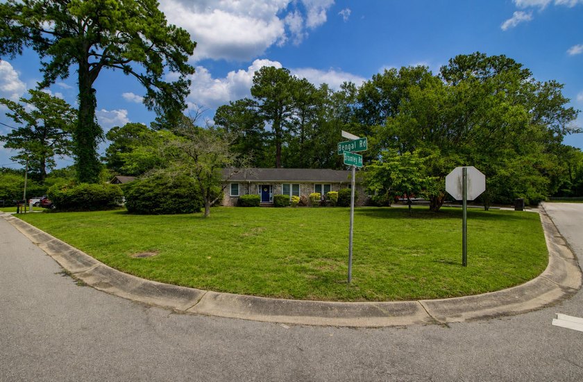 Situated on a spacious corner lot surrounded by mature trees - photo 37