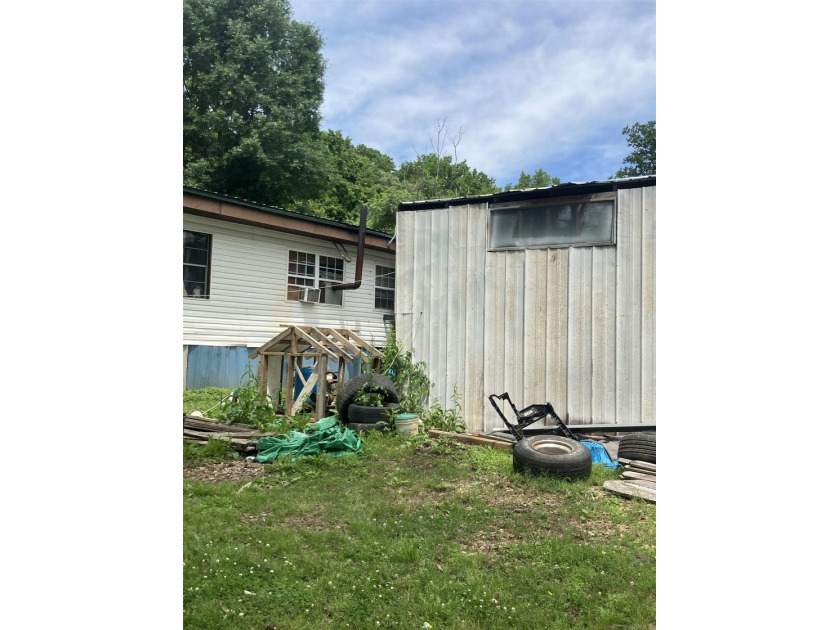 Tucked away on approximately 1 acre, this versatile manufactured - photo 12