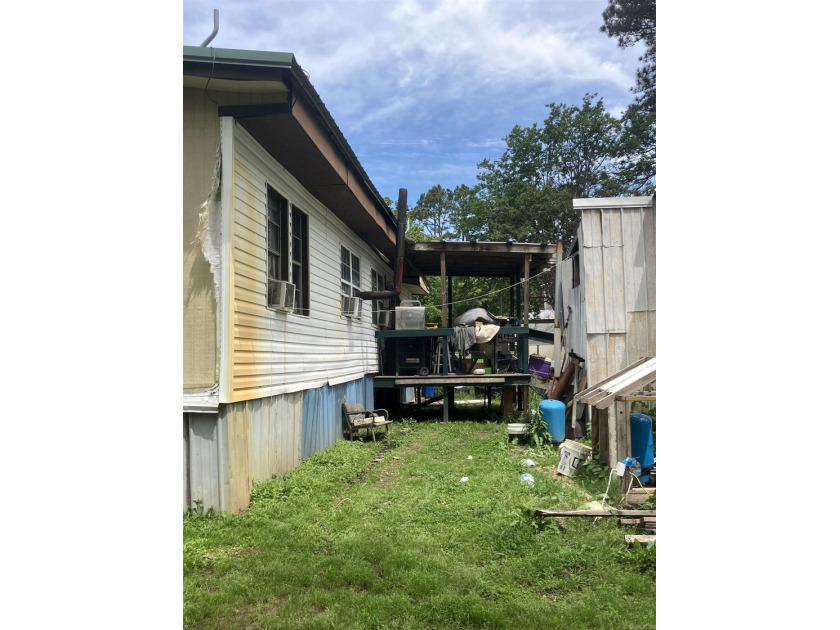 Tucked away on approximately 1 acre, this versatile manufactured - photo 14