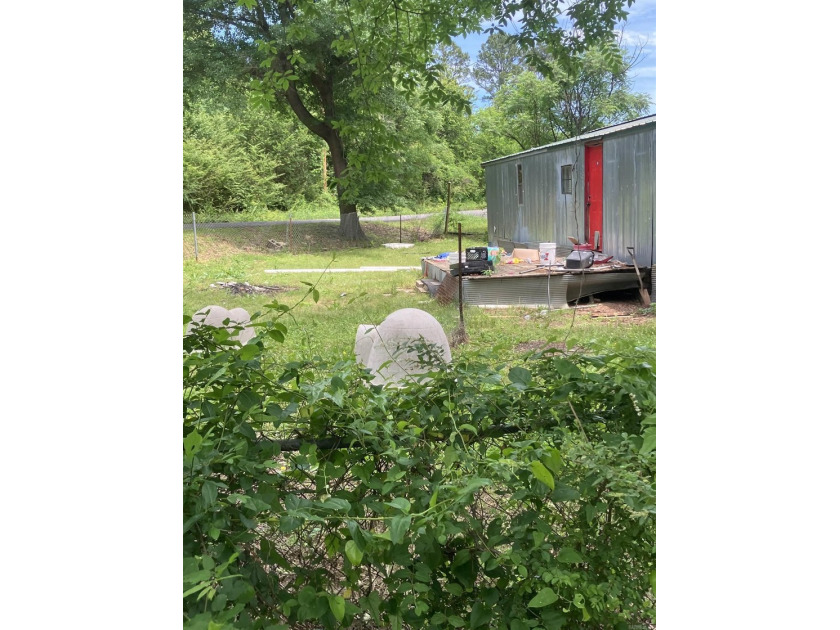 Tucked away on approximately 1 acre, this versatile manufactured - photo 16