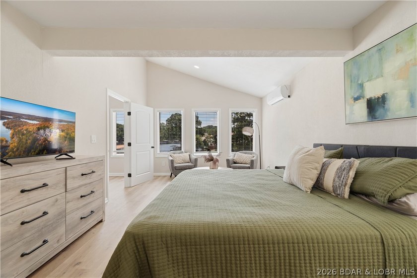 Lakefront living on 2 private acres at the 8MM near Laurie! - photo 16
