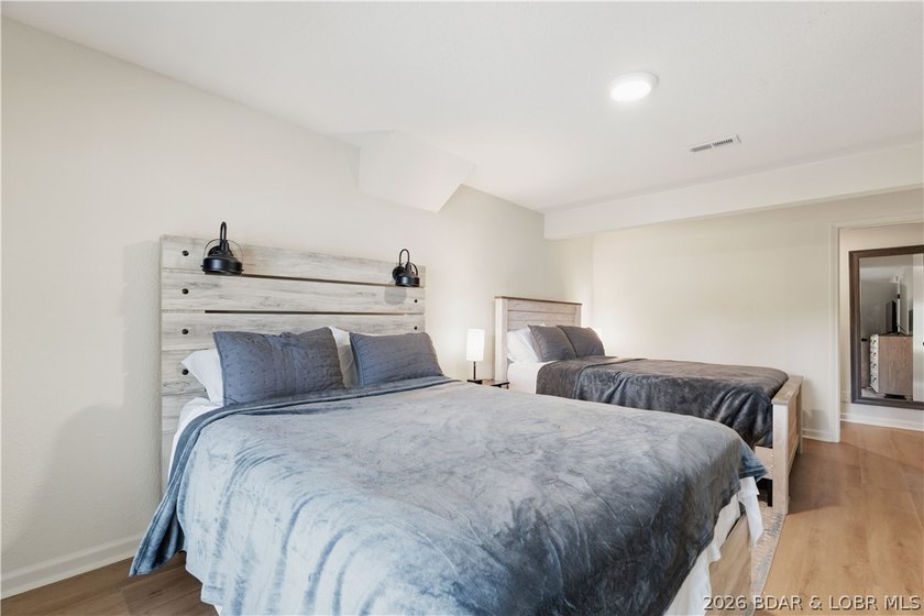 Lakefront living on 2 private acres at the 8MM near Laurie! - photo 17