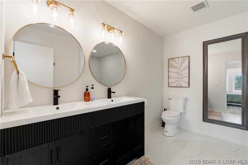 Lakefront living on 2 private acres at the 8MM near Laurie! - photo 32