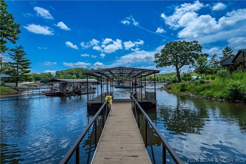 Lakefront living on 2 private acres at the 8MM near Laurie! - photo 37