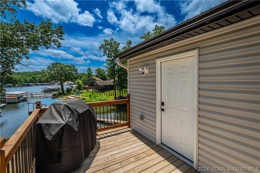 Lakefront living on 2 private acres at the 8MM near Laurie! - photo 39
