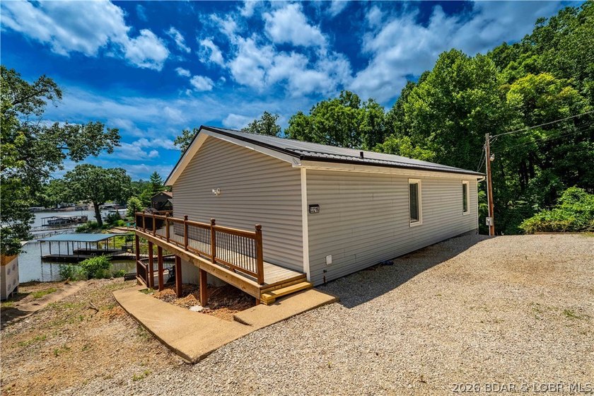 Lakefront living on 2 private acres at the 8MM near Laurie! - photo 40