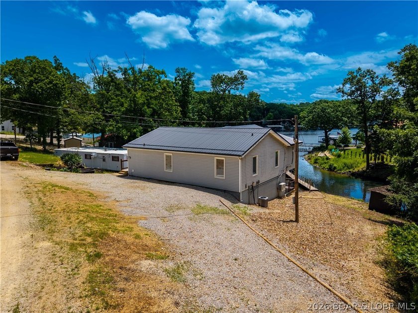 Lakefront living on 2 private acres at the 8MM near Laurie! - photo 43