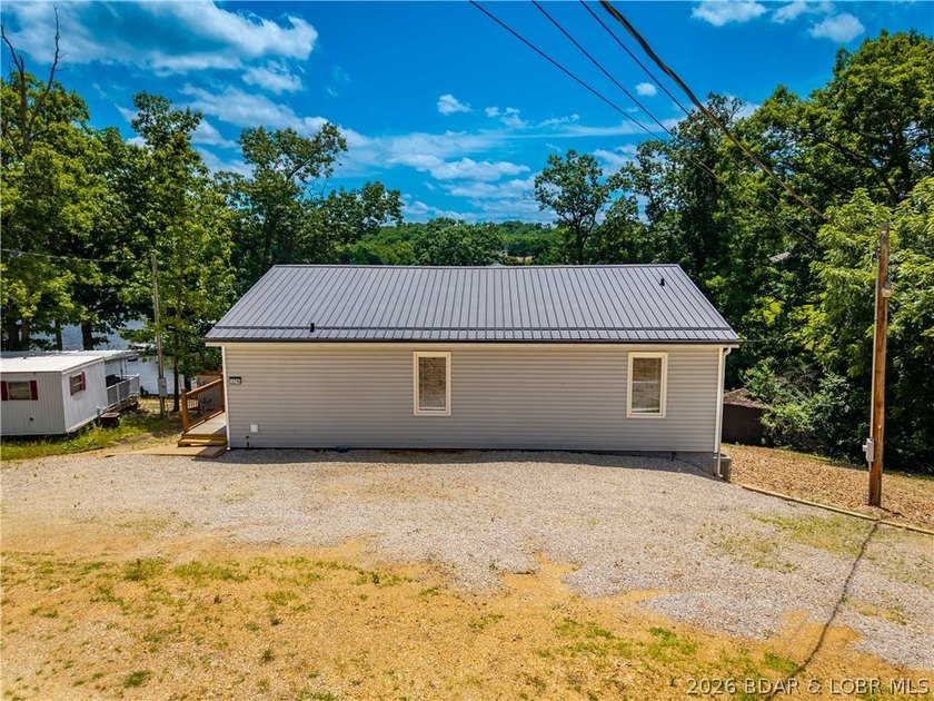 Lakefront living on 2 private acres at the 8MM near Laurie! - photo 44