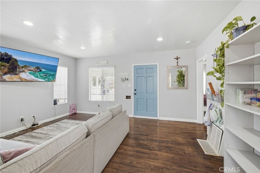 Nestled on a quiet tree lined street in North Long Beach, this - photo 12