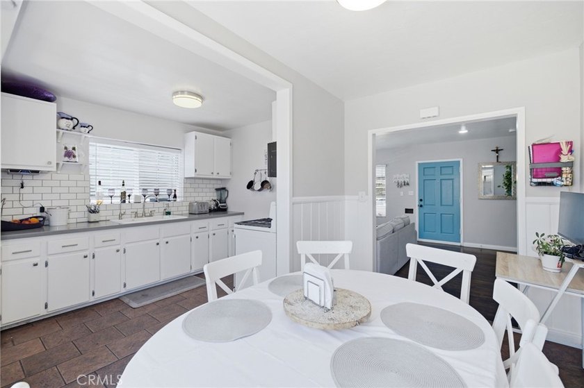 Nestled on a quiet tree lined street in North Long Beach, this - photo 15