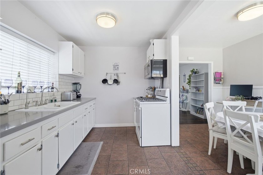 Nestled on a quiet tree lined street in North Long Beach, this - photo 17