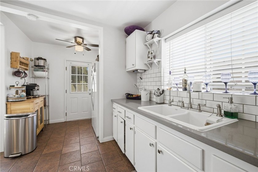 Nestled on a quiet tree lined street in North Long Beach, this - photo 18