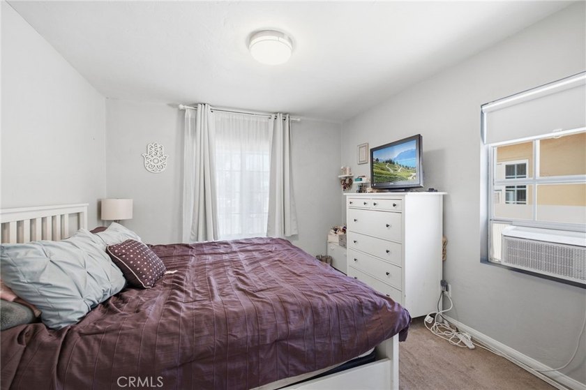 Nestled on a quiet tree lined street in North Long Beach, this - photo 22