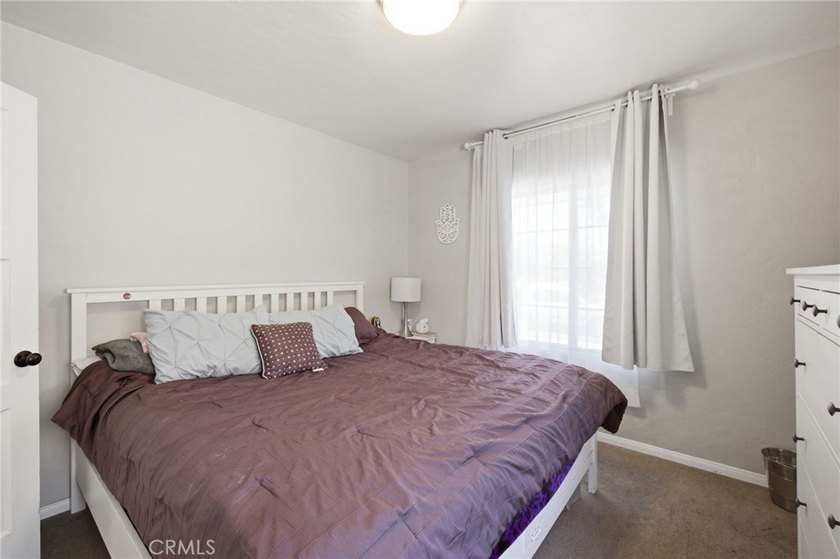 Nestled on a quiet tree lined street in North Long Beach, this - photo 23