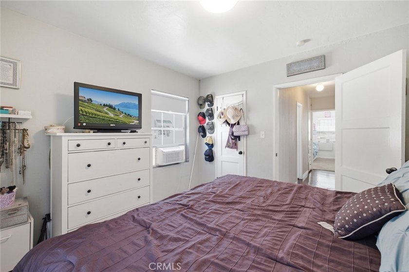 Nestled on a quiet tree lined street in North Long Beach, this - photo 24