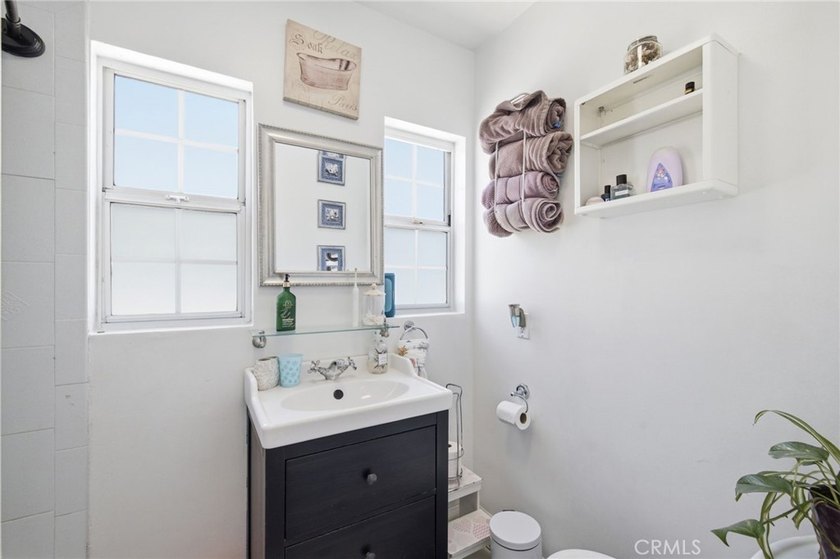 Nestled on a quiet tree lined street in North Long Beach, this - photo 25
