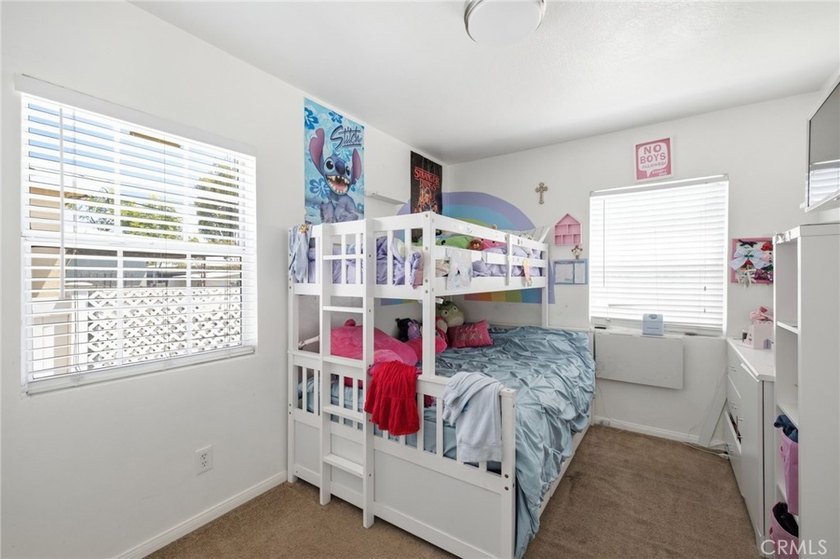 Nestled on a quiet tree lined street in North Long Beach, this - photo 27