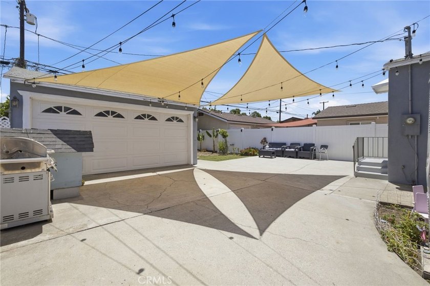 Nestled on a quiet tree lined street in North Long Beach, this - photo 29