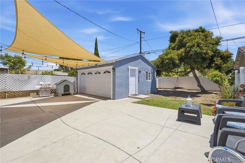 Nestled on a quiet tree lined street in North Long Beach, this - photo 32