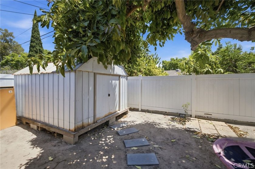 Nestled on a quiet tree lined street in North Long Beach, this - photo 34