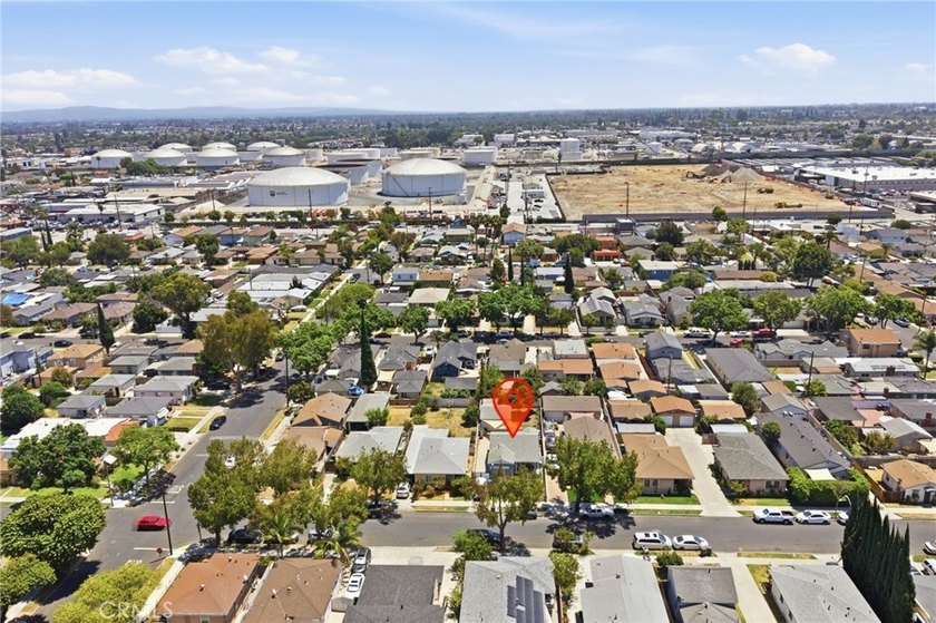 Nestled on a quiet tree lined street in North Long Beach, this - photo 36