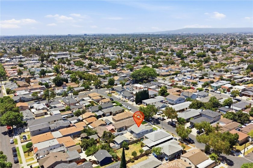 Nestled on a quiet tree lined street in North Long Beach, this - photo 37
