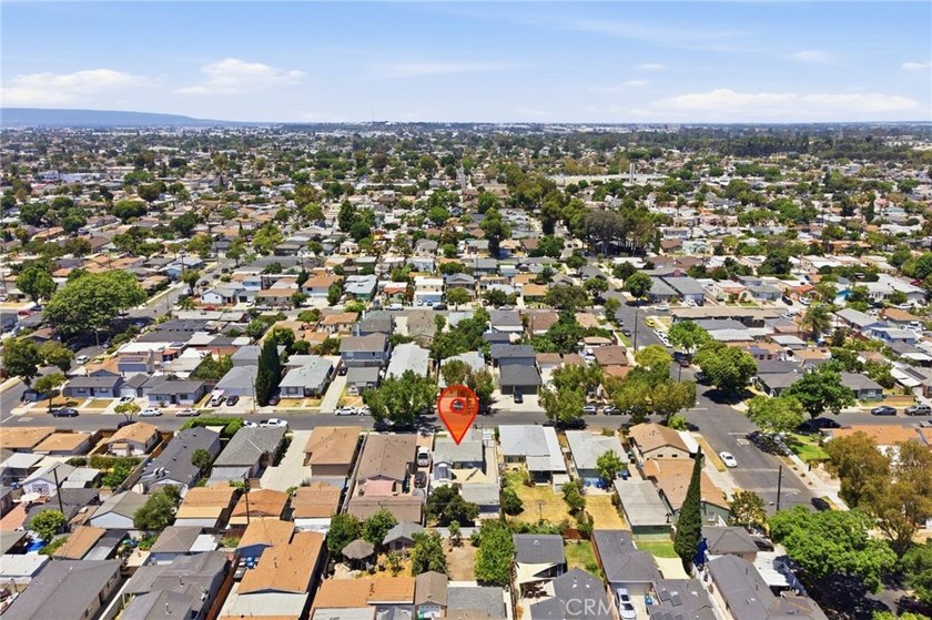 Nestled on a quiet tree lined street in North Long Beach, this - photo 38