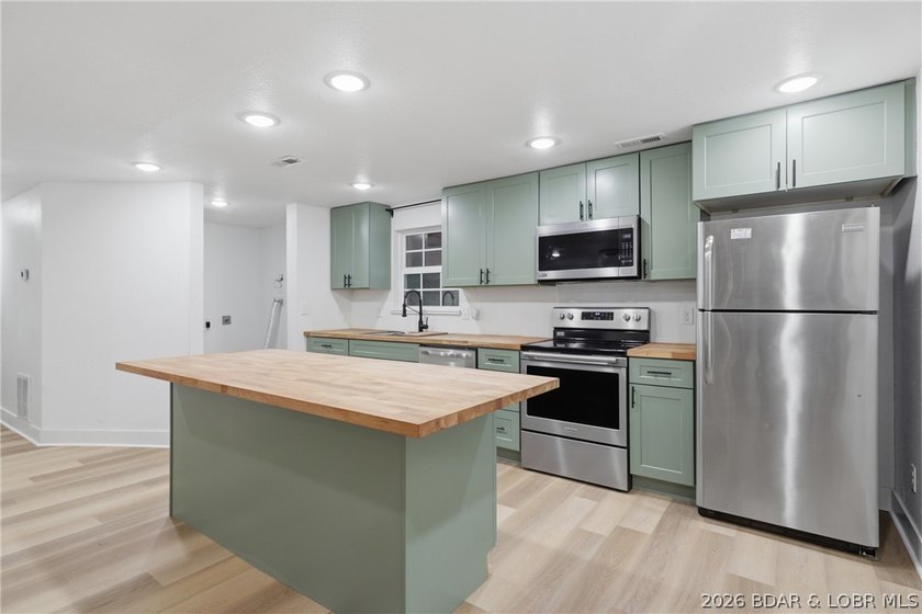 Experience the charm of lakeside living in this beautifully - photo 16