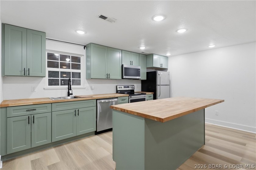 Experience the charm of lakeside living in this beautifully - photo 17