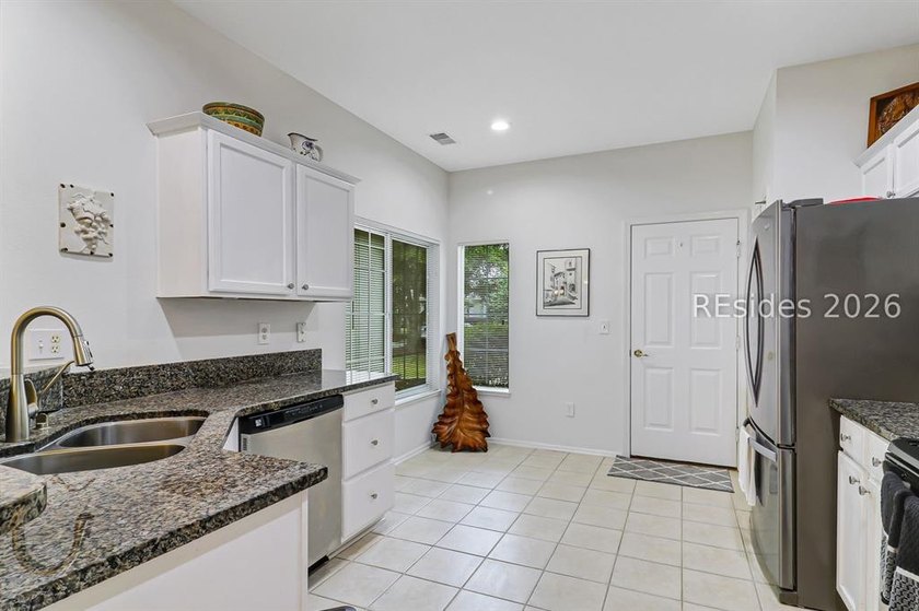 Tucked beneath a canopy of mature trees on the desirable - photo 14
