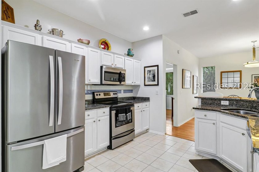 Tucked beneath a canopy of mature trees on the desirable - photo 16