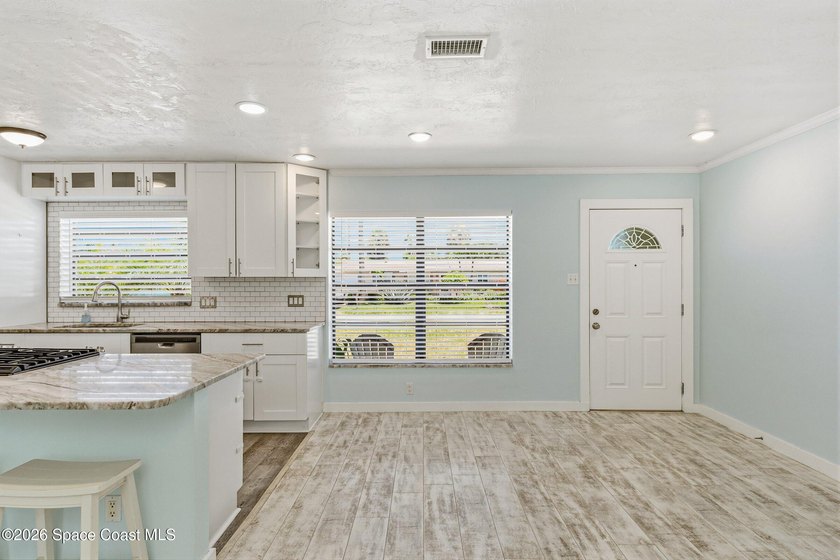 Embrace the ultimate beachside lifestyle in this beautifully - photo 8