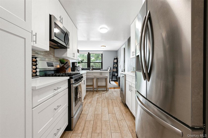 Welcome to this sprawling 3-bedroom, 2-bathroom corner unit in - photo 13