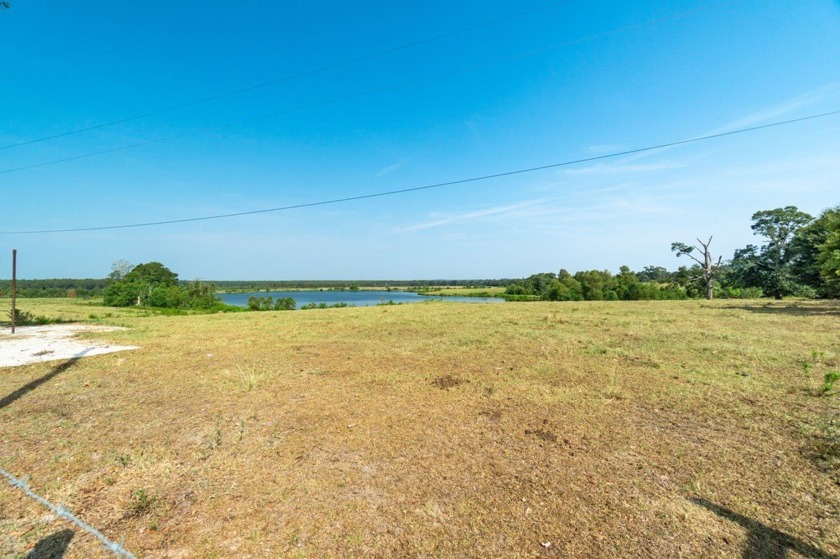 A 6.79-acre stunning lake front lot that's mostly cleared with a - photo 2