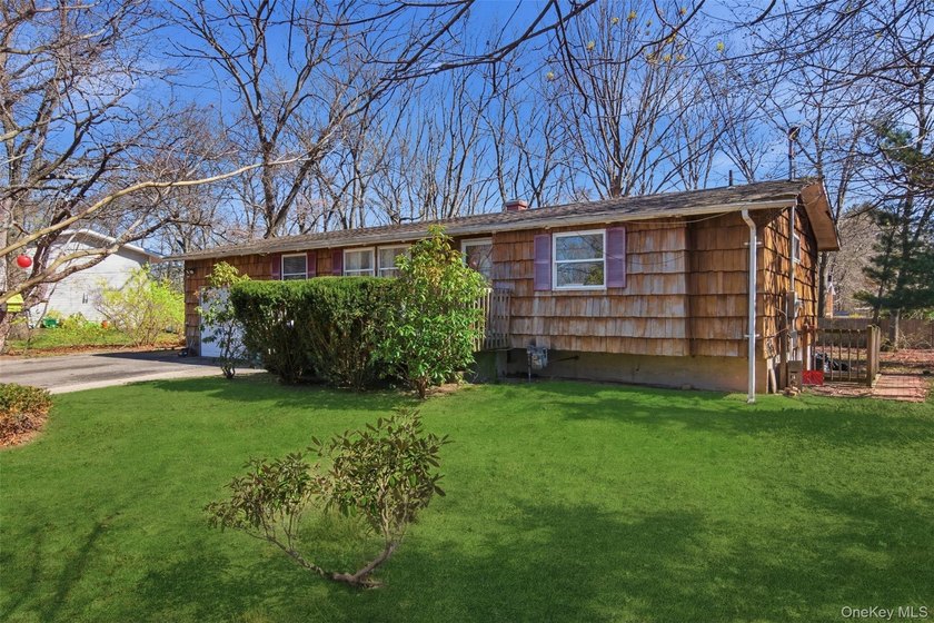 Nestled in Three Village School District, this four bedroom - photo 2
