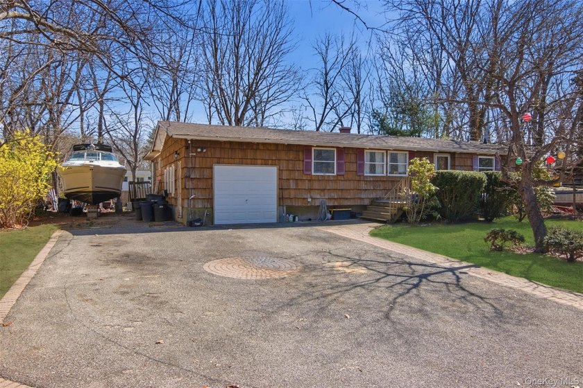 Nestled in Three Village School District, this four bedroom - photo 3