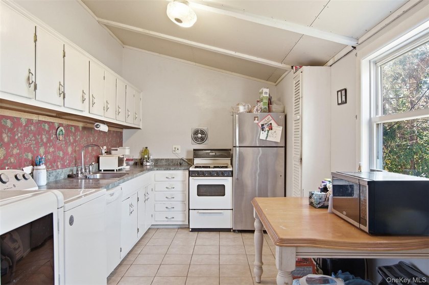 Nestled in Three Village School District, this four bedroom - photo 8