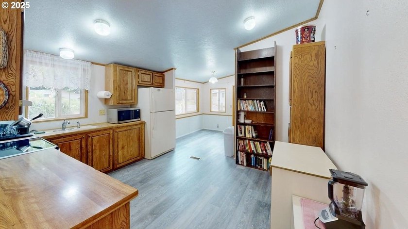 Move-in ready 1991 Skyline home in Port Orford! Features include - photo 9