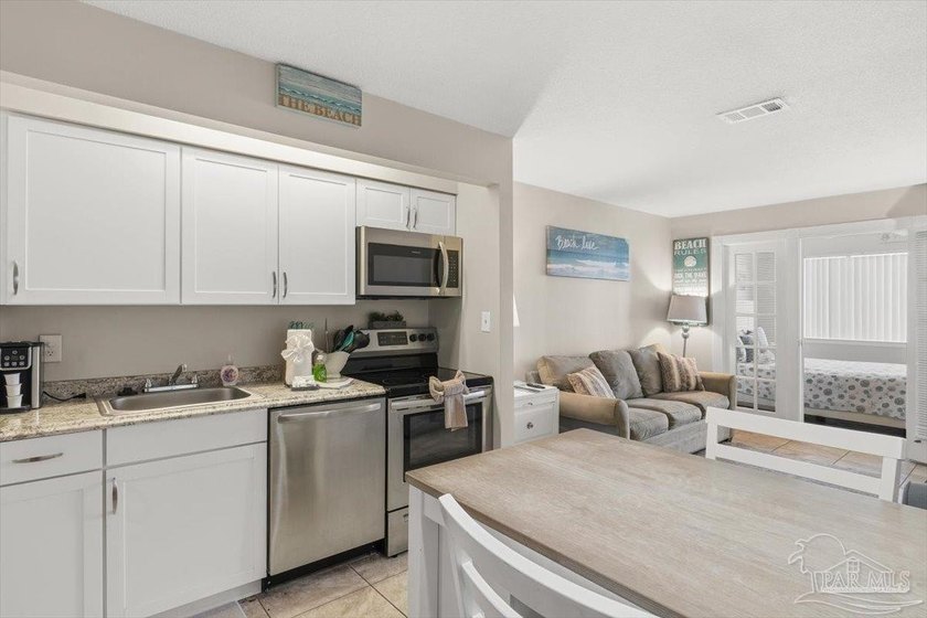 Top-floor condominium at The Palms at Sunset Harbor, just steps - photo 6
