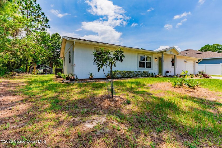 Escape the ordinary! This move-in-ready 4-bedroom, 2-bath home - photo 2