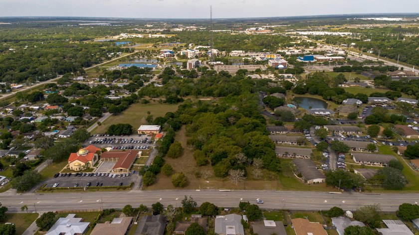 This prime 4.87-acre parcel is strategically located in a highly - photo 12