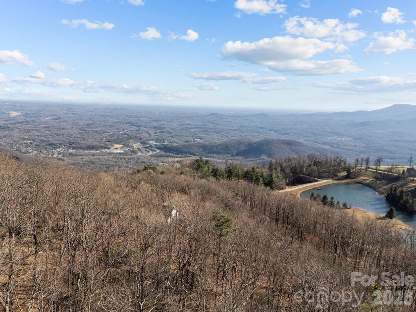 Perched above the waterfalls just beneath the clouds is a gently - photo 8