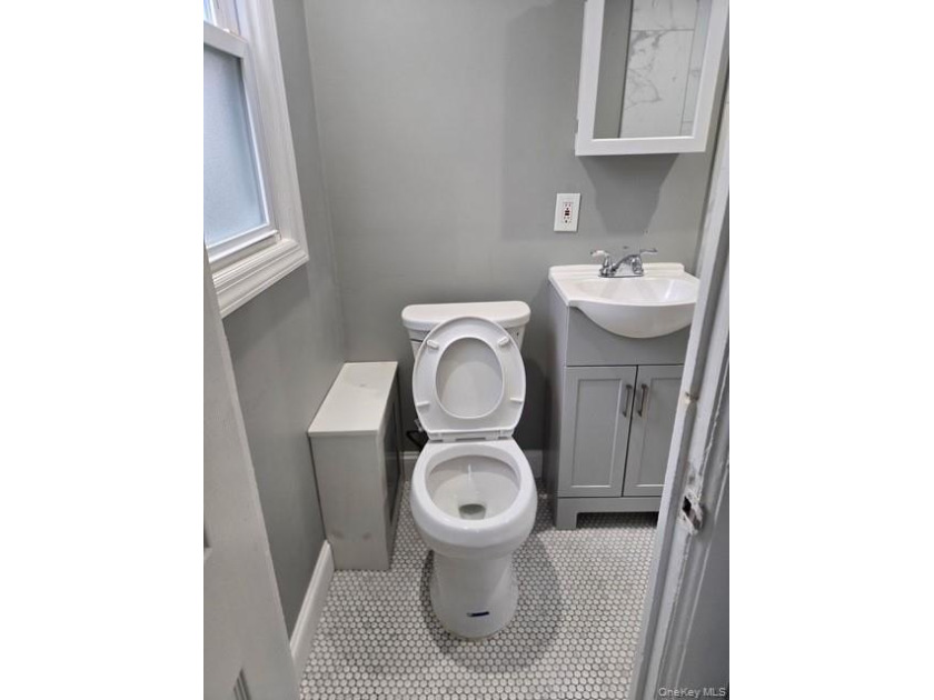 Centrally located two-family home offering a strong opportunity - photo 7