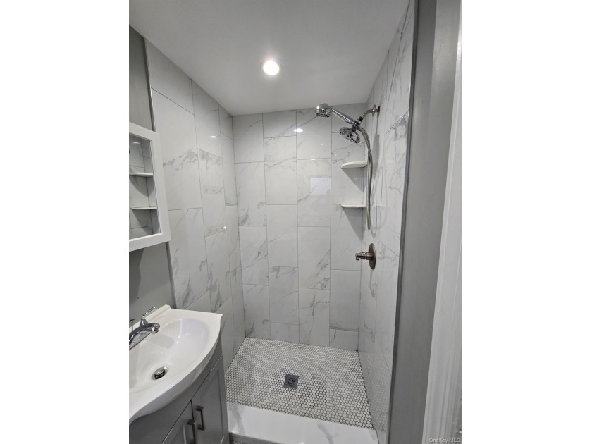 Centrally located two-family home offering a strong opportunity - photo 9