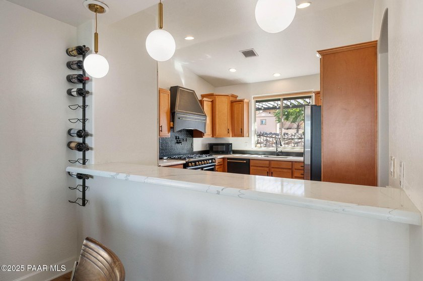 Luxury meets low-maintenance living in this exquisitely updated - photo 10