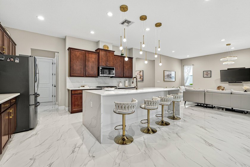 This beautifully updated 5-bedroom, 4-bath home offers the - photo 12