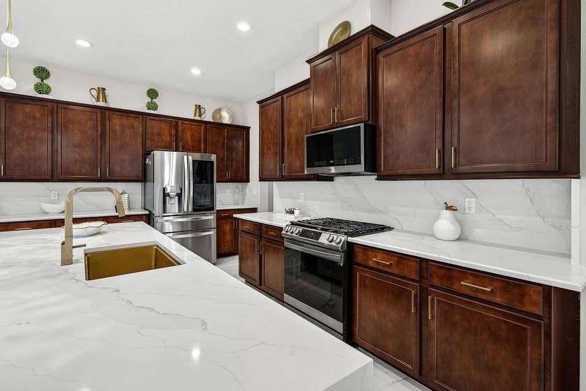 This beautifully updated 5-bedroom, 4-bath home offers the - photo 14